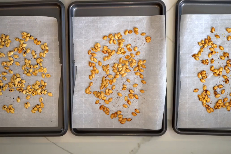 On a tray, roasted pumpkin seeds.