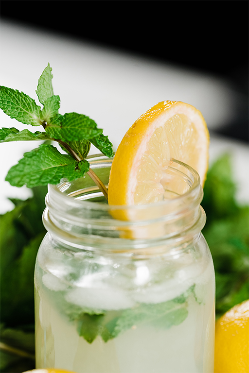 An original glass of lemonade with a lemon slice at the top.