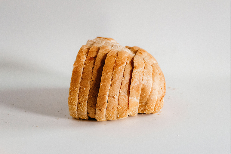 Half a loaf of bread, cut into slices