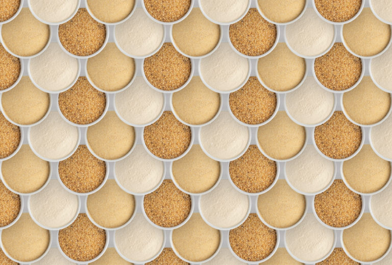 Multiple small white bowls in a fish scale formation filled with minced and powder Garlic