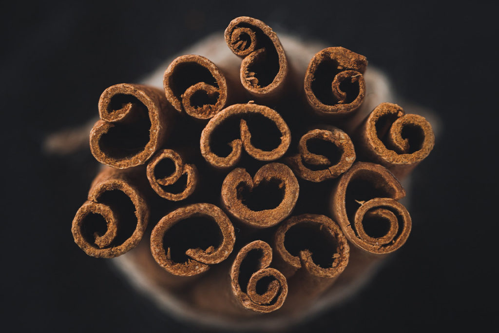 close up of top of cinnamon sticks bunched together