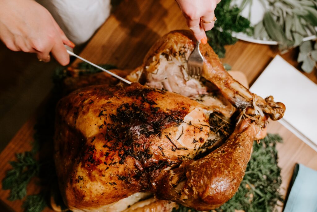 Thanksgiving turkey being cut.