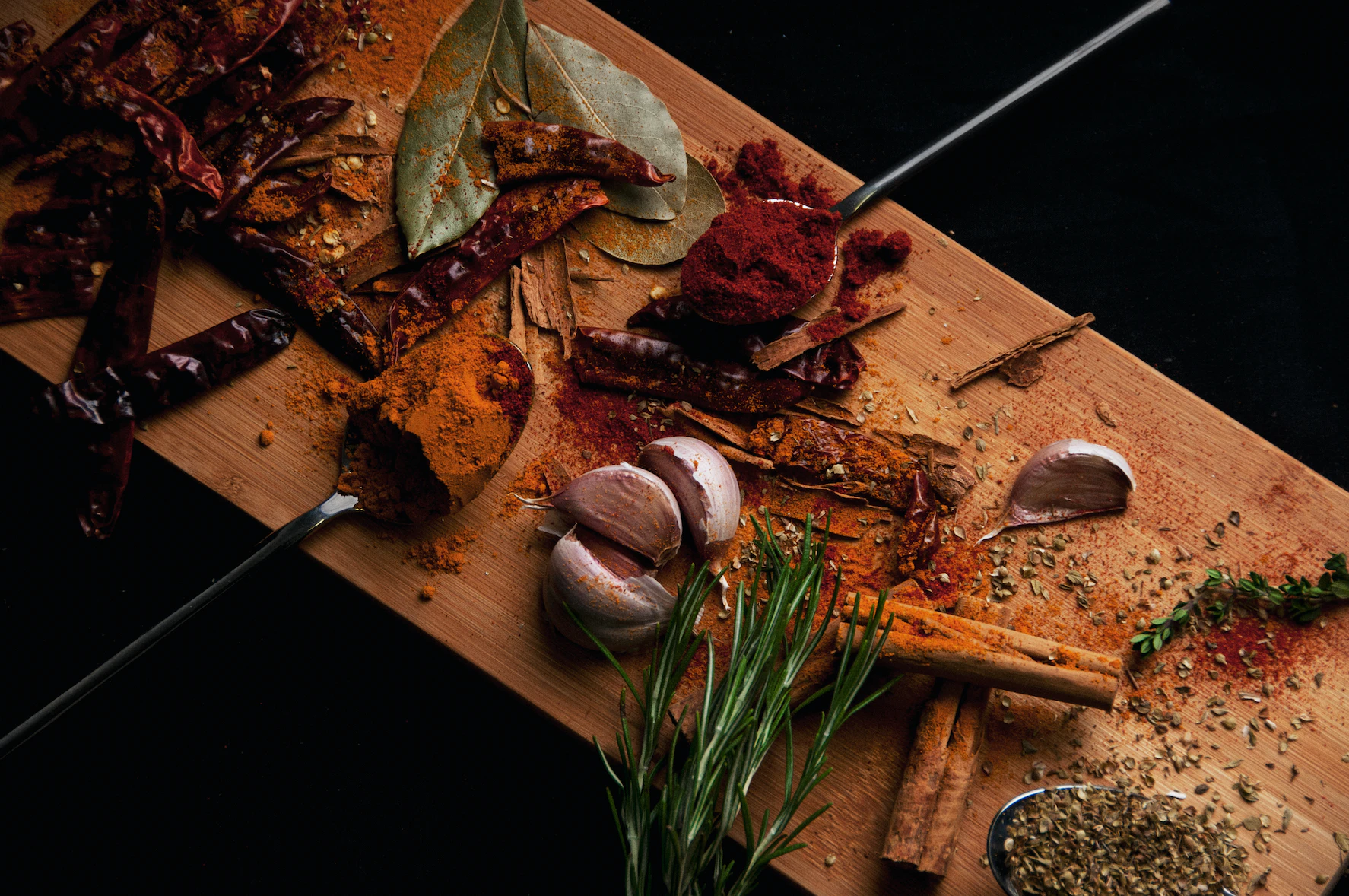 Chopping board of herbs and spices.