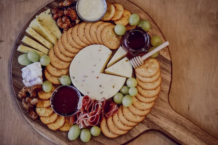 Cheese board with fruit and crackers. A whole charcuterie board.
