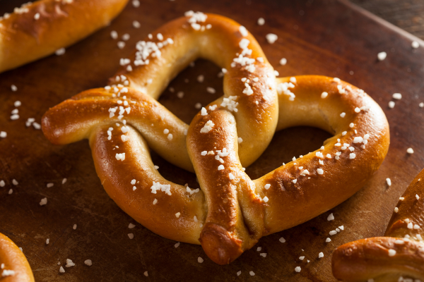 A salty pretzel ready to be eaten.