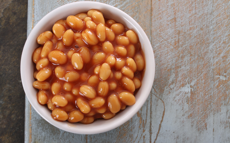 Navy Beans in a white bowl on a gray countertop.