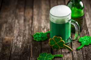 St. Patrick's Day themed green beer on a wooden table