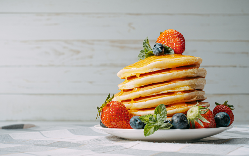 buttermilk powder used to make delicious pancakes with fruit adorned around it
