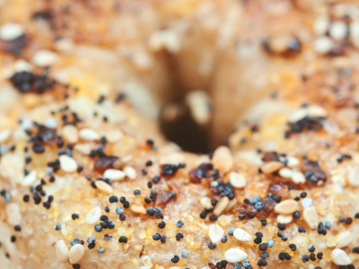 A close up picture of an everything bagel.
