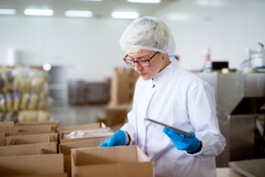 A research and development worker checking the contents of a box