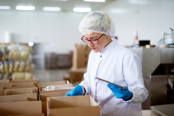 A research and development worker checking the contents of a box