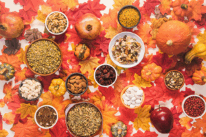 fall superfoods in bowls gathered over autumn leaves