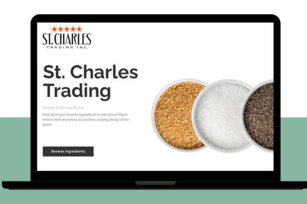 Laptop with St. Charles Trading written across the portal website with three bowls of ingredients appearing on the screen